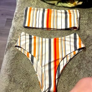 From Shane size medium orange, white, and gray